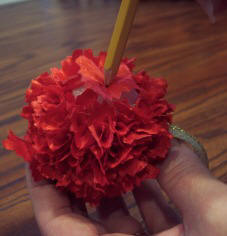 Use a pencil to poke scrap fabric into a Styrofoam ball to make an easy kids Christmas craft.
